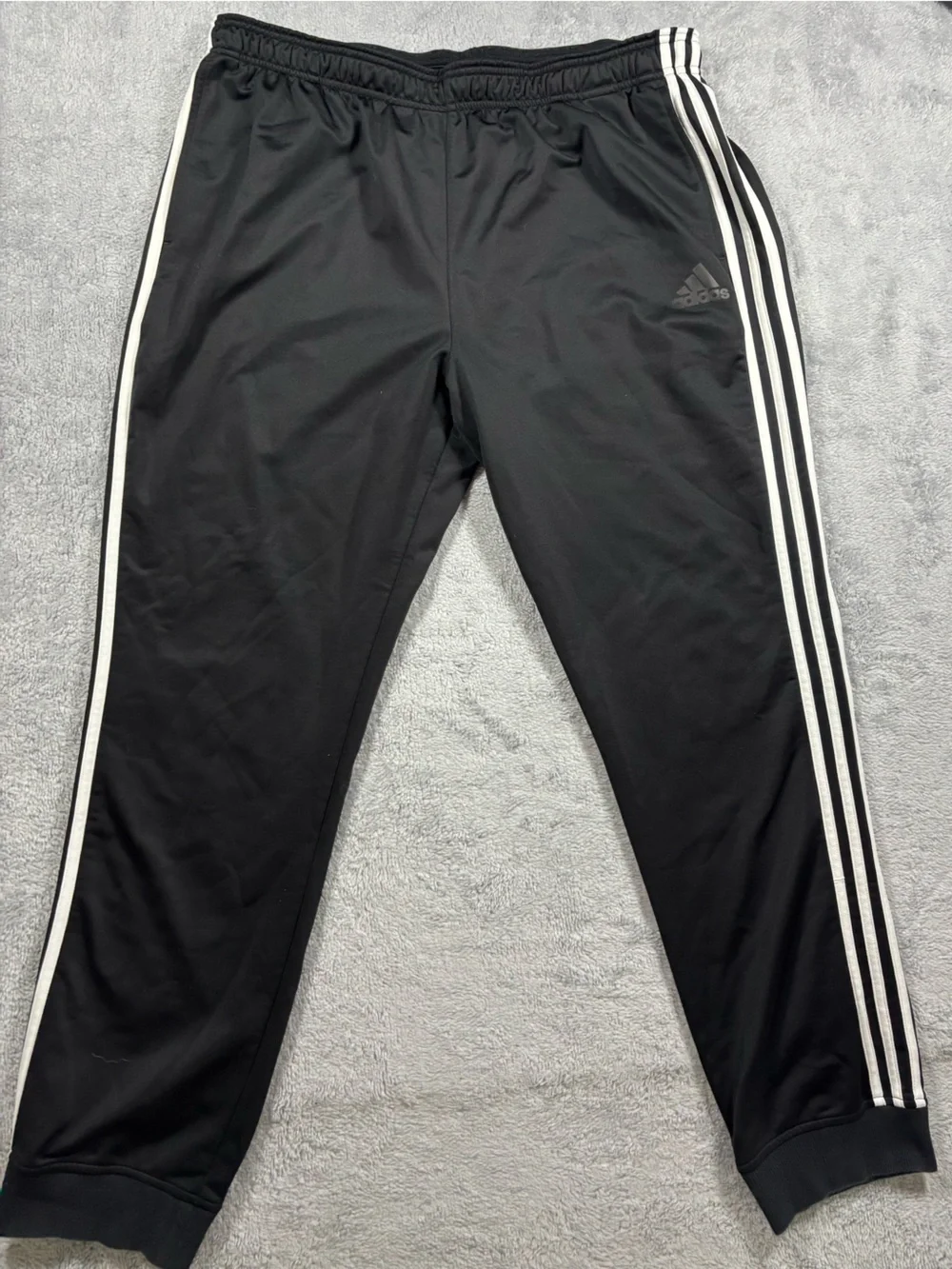 Adidas black track pants with white stripes